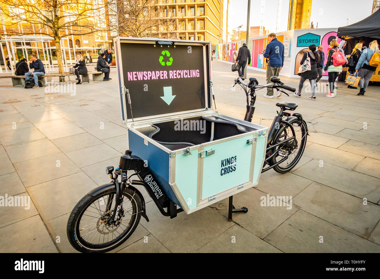 The Urban Arrow Cargo Bike with the cargo lid open ready for recycling newspapers near Kings Cross Station in London, England Stock Photo