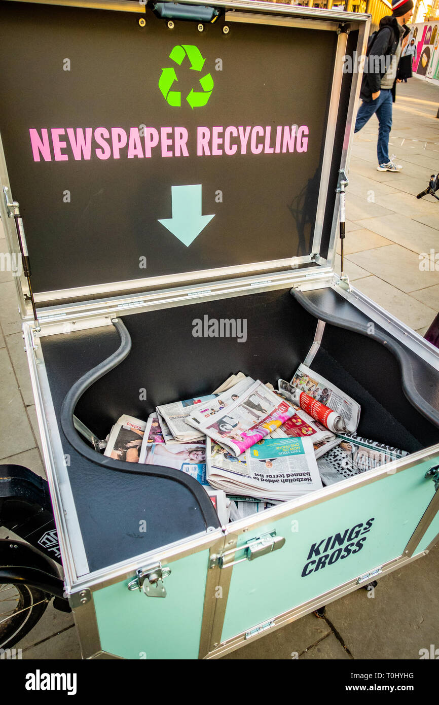 The Urban Arrow Cargo Bike with the cargo lid open ready for recycling newspapers near Kings Cross Station in London, England Stock Photo