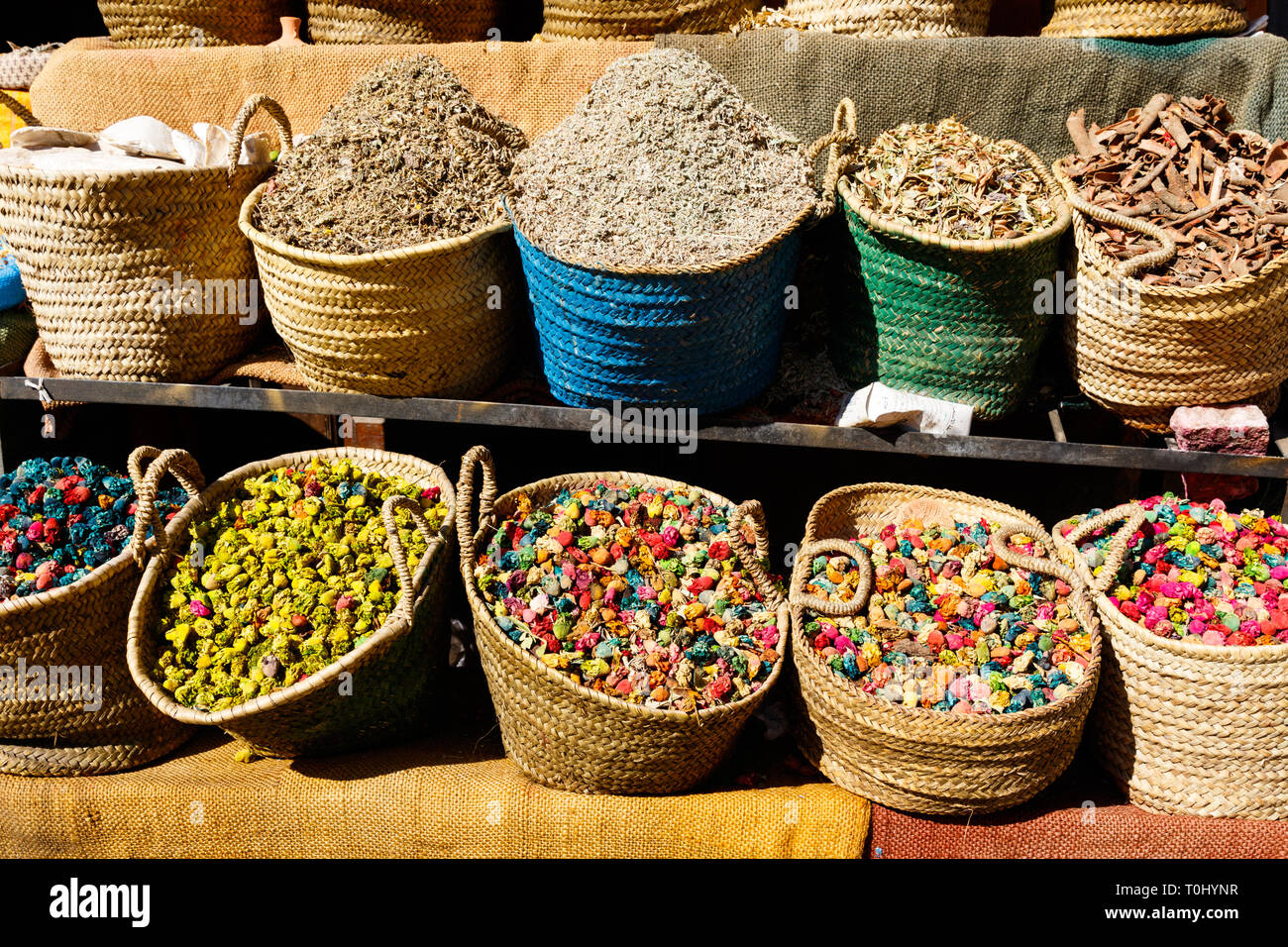 Colorful cooking Spices and flower in traditional local medina bazaar market in Marrakesh, Morocco Stock Photo