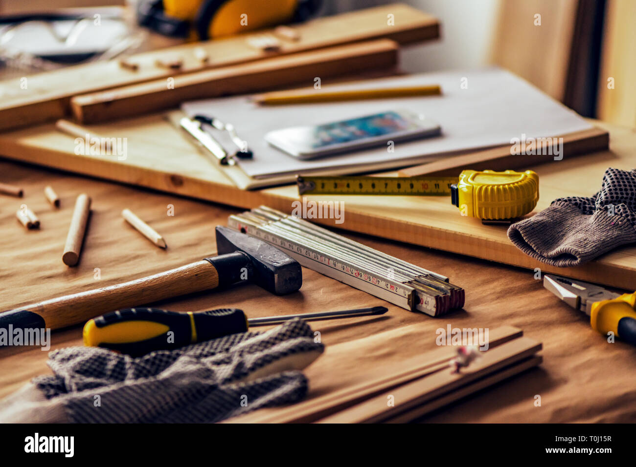 Various tools on carpentry woodwork workshop desk, selective focus with shallow depth of field Stock Photo