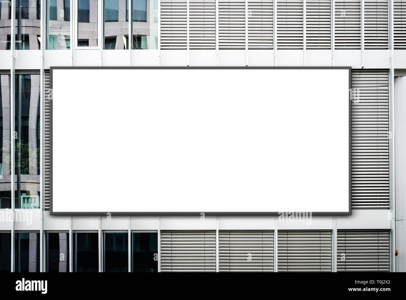 blank banner on office building / empty billboard on facade - advertisment mockup Stock Photo