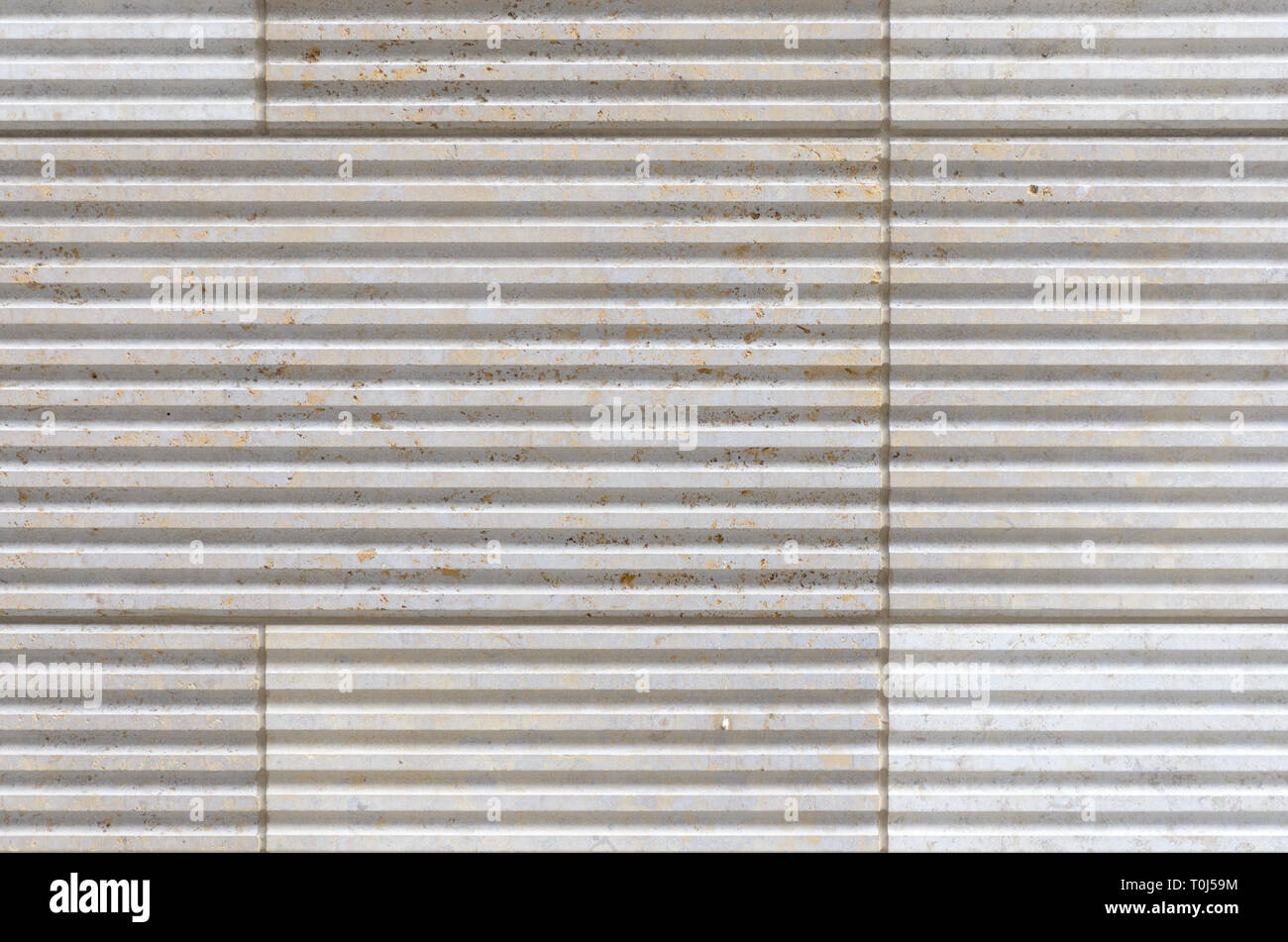 Linear decorative tiles with ribbed relief viewed in full frame and ...