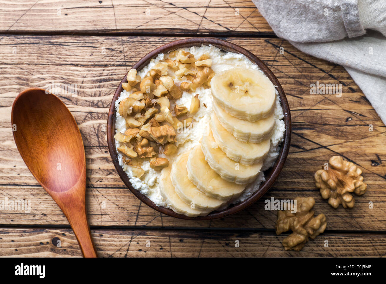Healthy Breakfast Cottage Cheese With Banana And Walnuts On