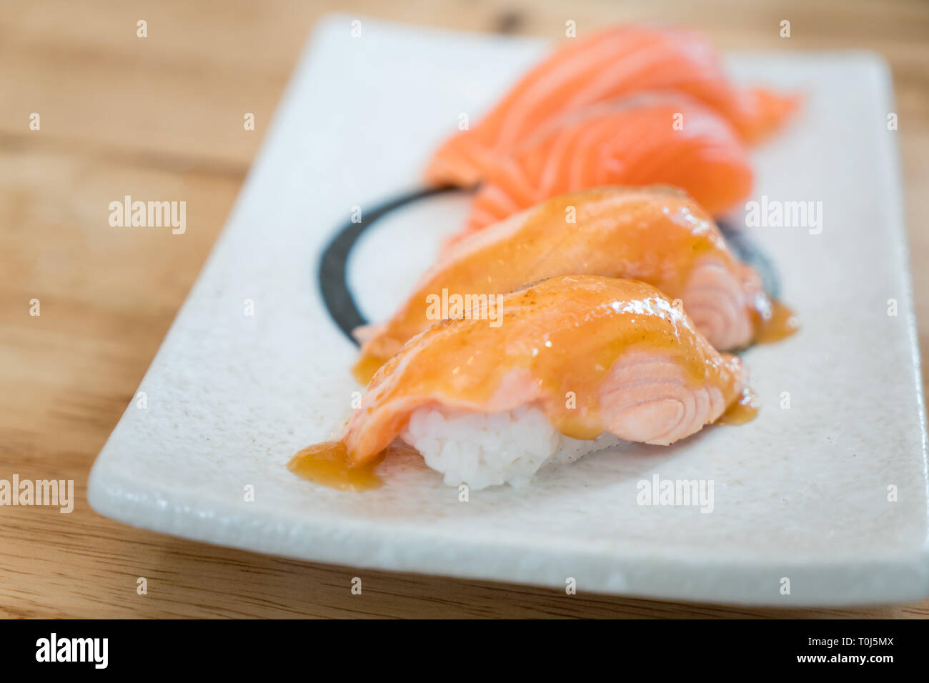 Close up salmon burned top with mayo in plate. Healthy Japanese Nigiri