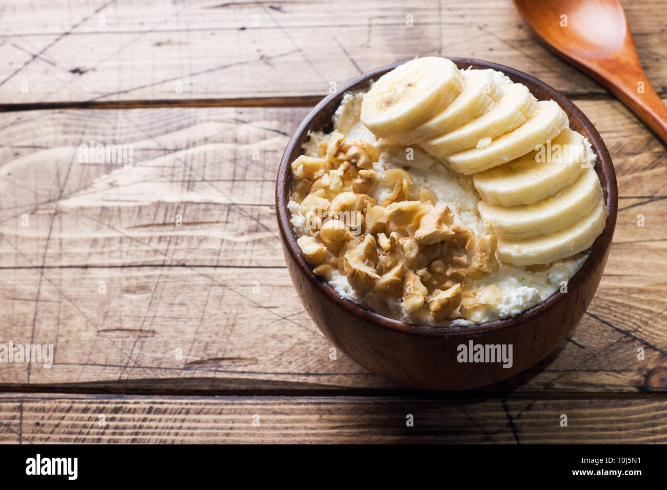 Healthy Breakfast Cottage Cheese With Banana And Walnuts On