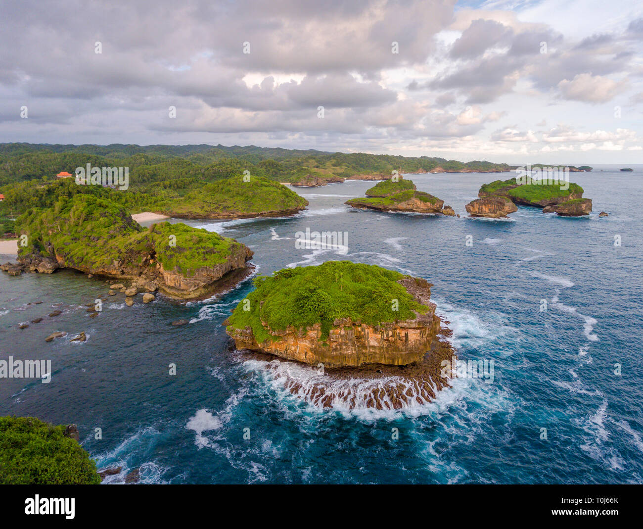 Remarkable and unique rock formation in the southern coast of Pacitan, East Java. It is called Watukarung Stock Photo