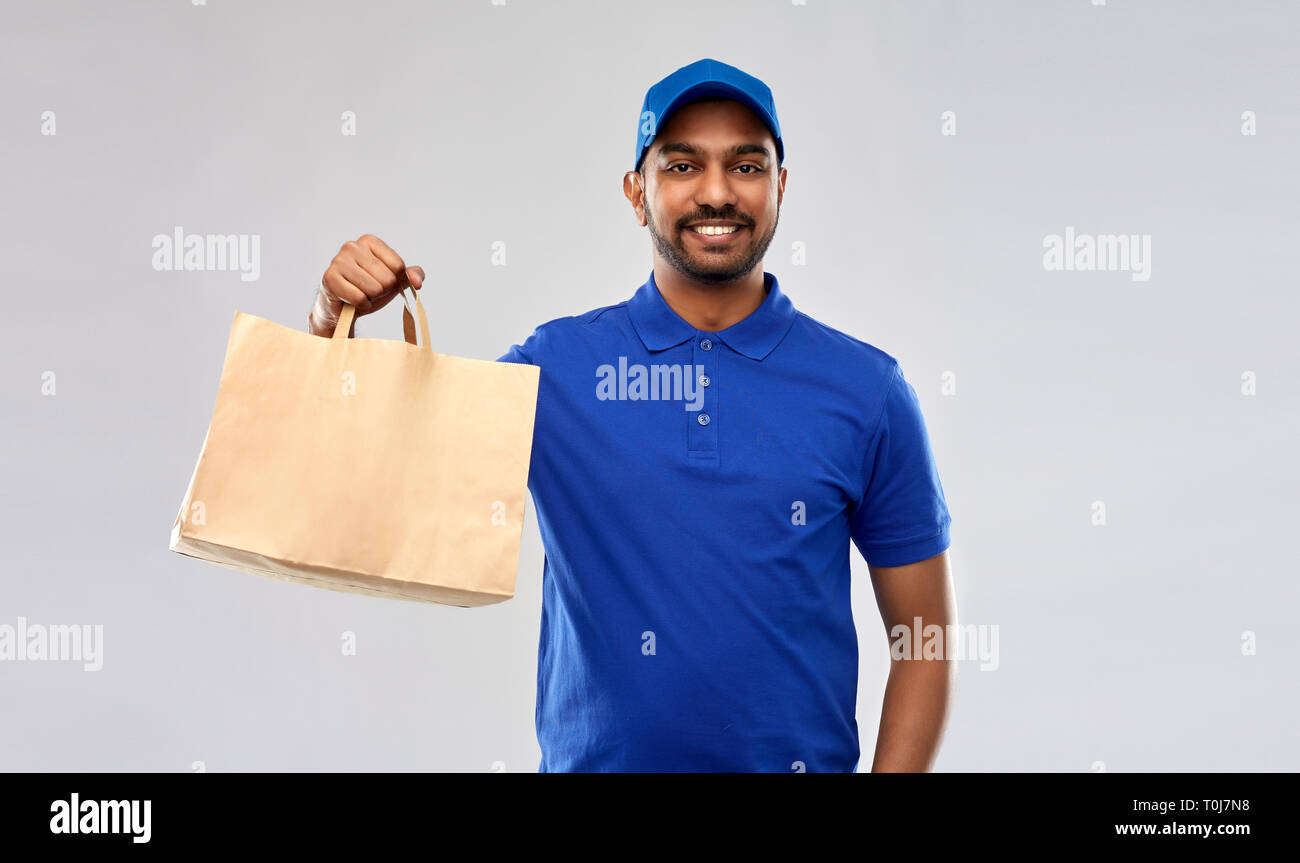 happy indian delivery man with food in paper bag Stock Photo Alamy