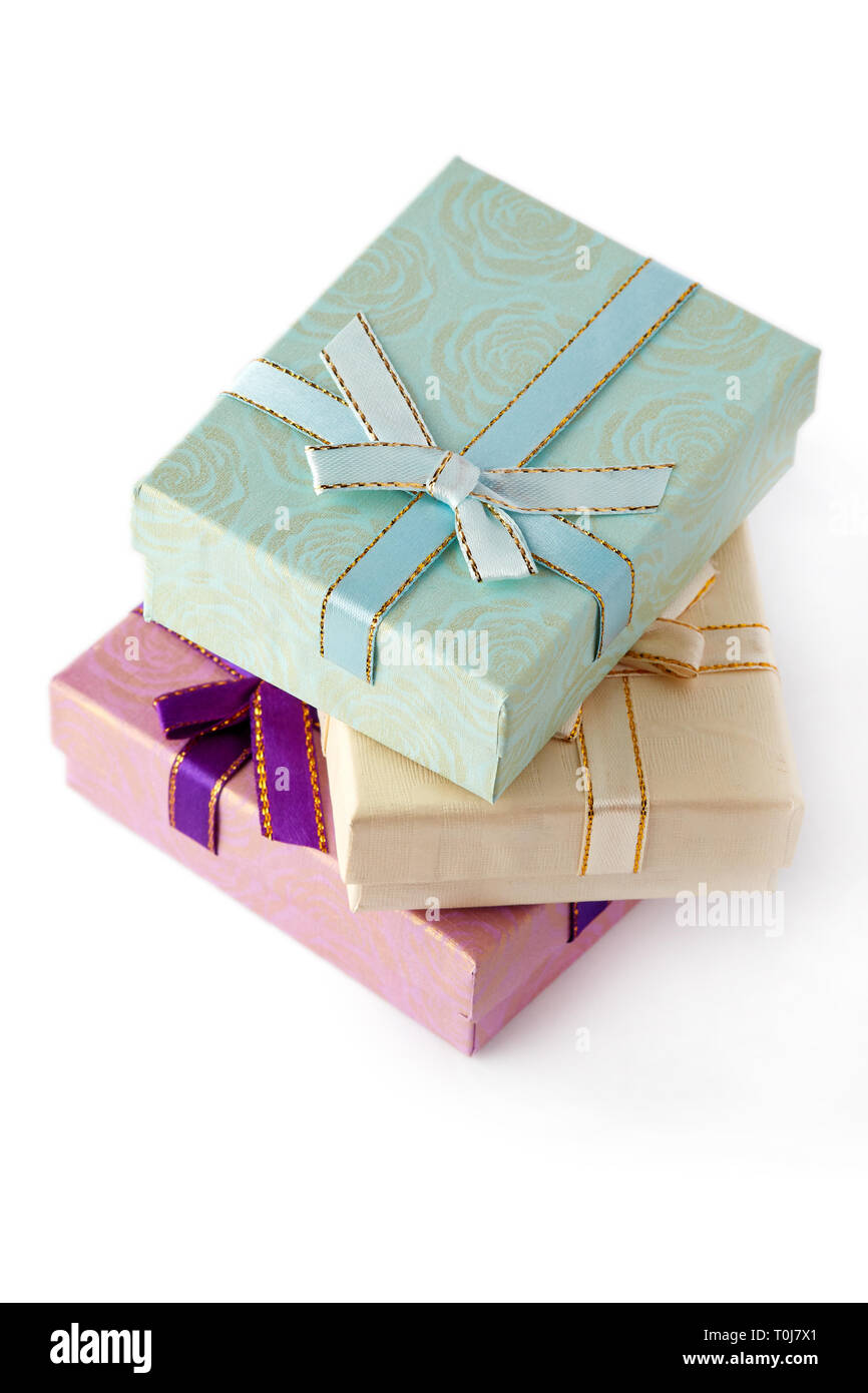 Three gift boxes with bow isolated on white background Stock Photo - Alamy