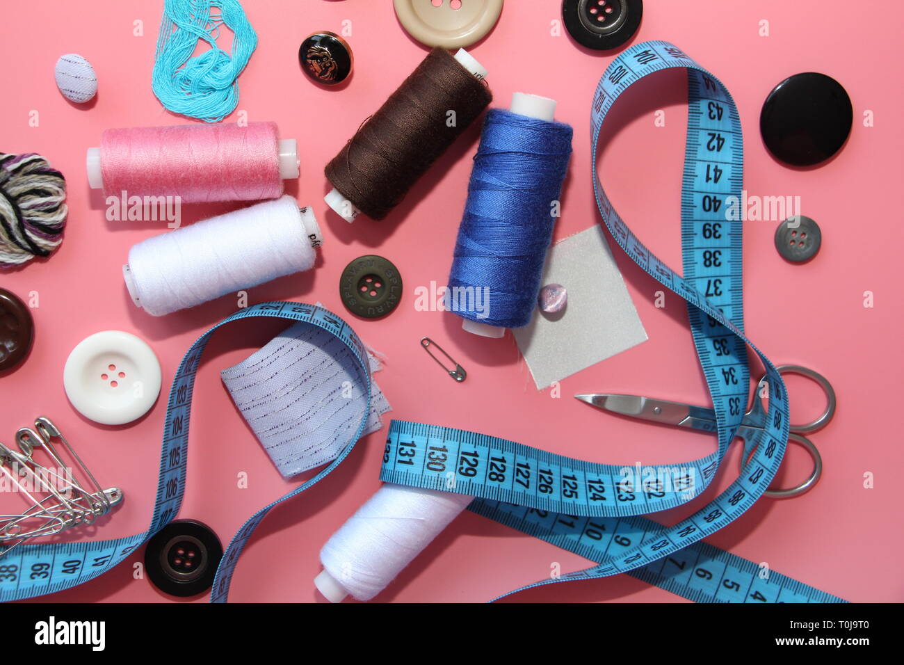 A set of tools for the tailor - thread, scissors, pins, coils, needles ...