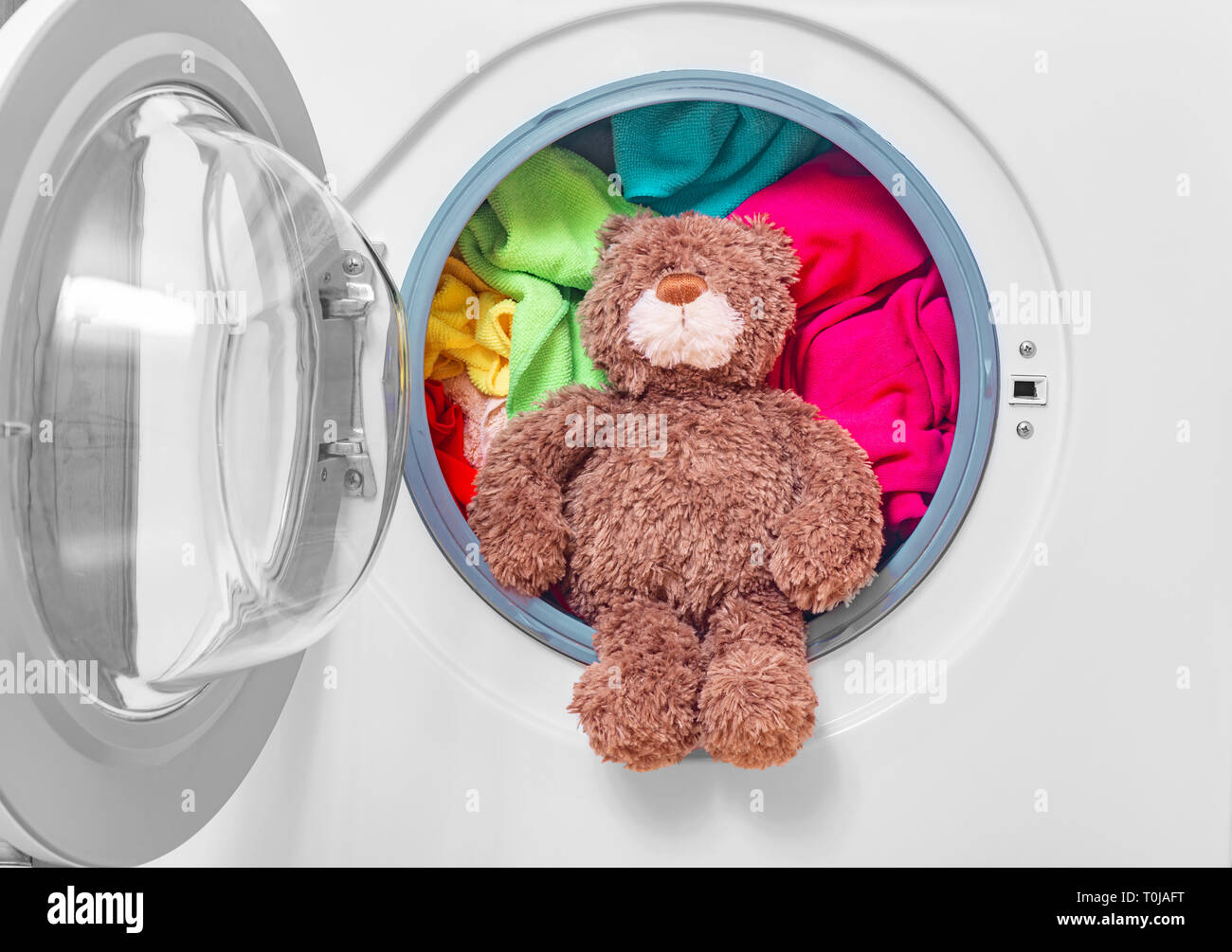 washing teddy bear in washing machine