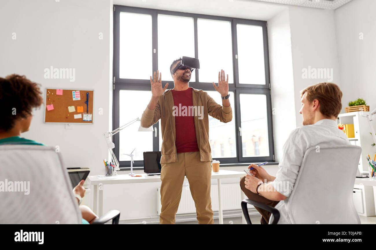 developers with virtual reality headset at office Stock Photo
