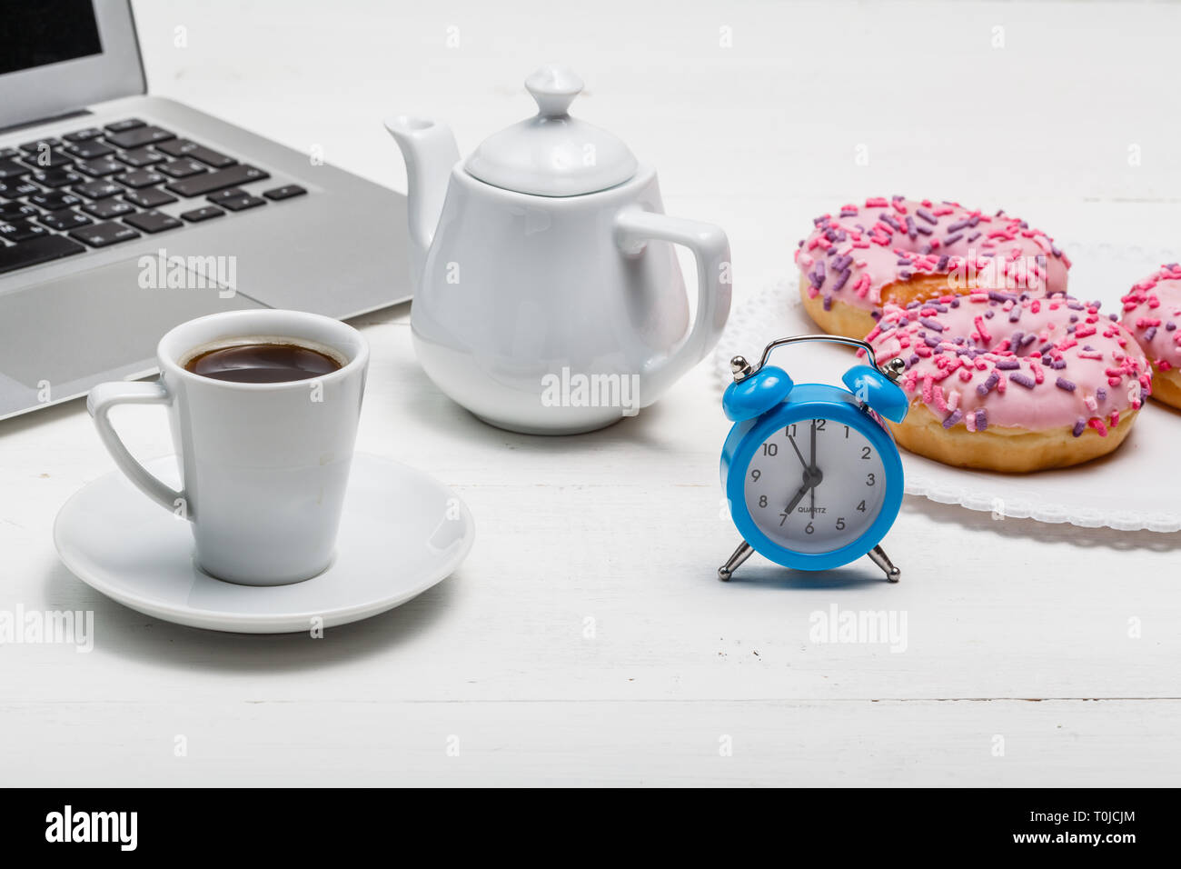 Fresh donut served with a cup of coffee Stock Photo