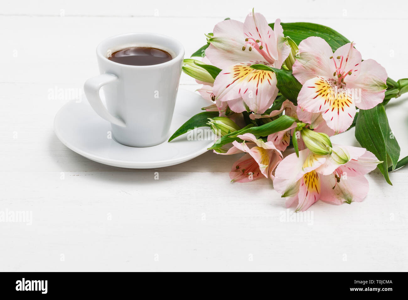drinking coffee and using digital tablet in the morning Stock Photo