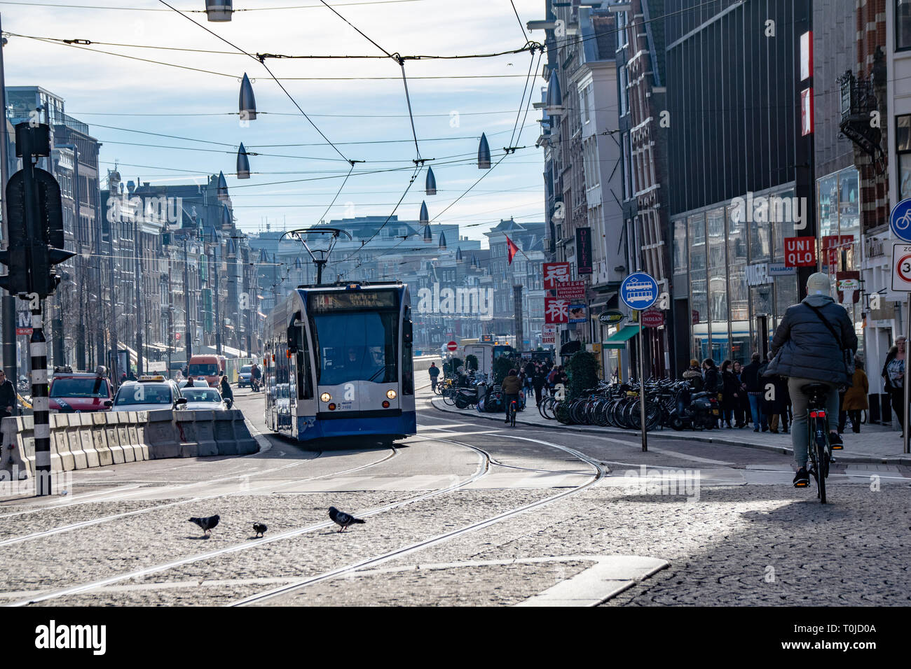 Transport around Amsterdam with trams and bicycle lanes. The
