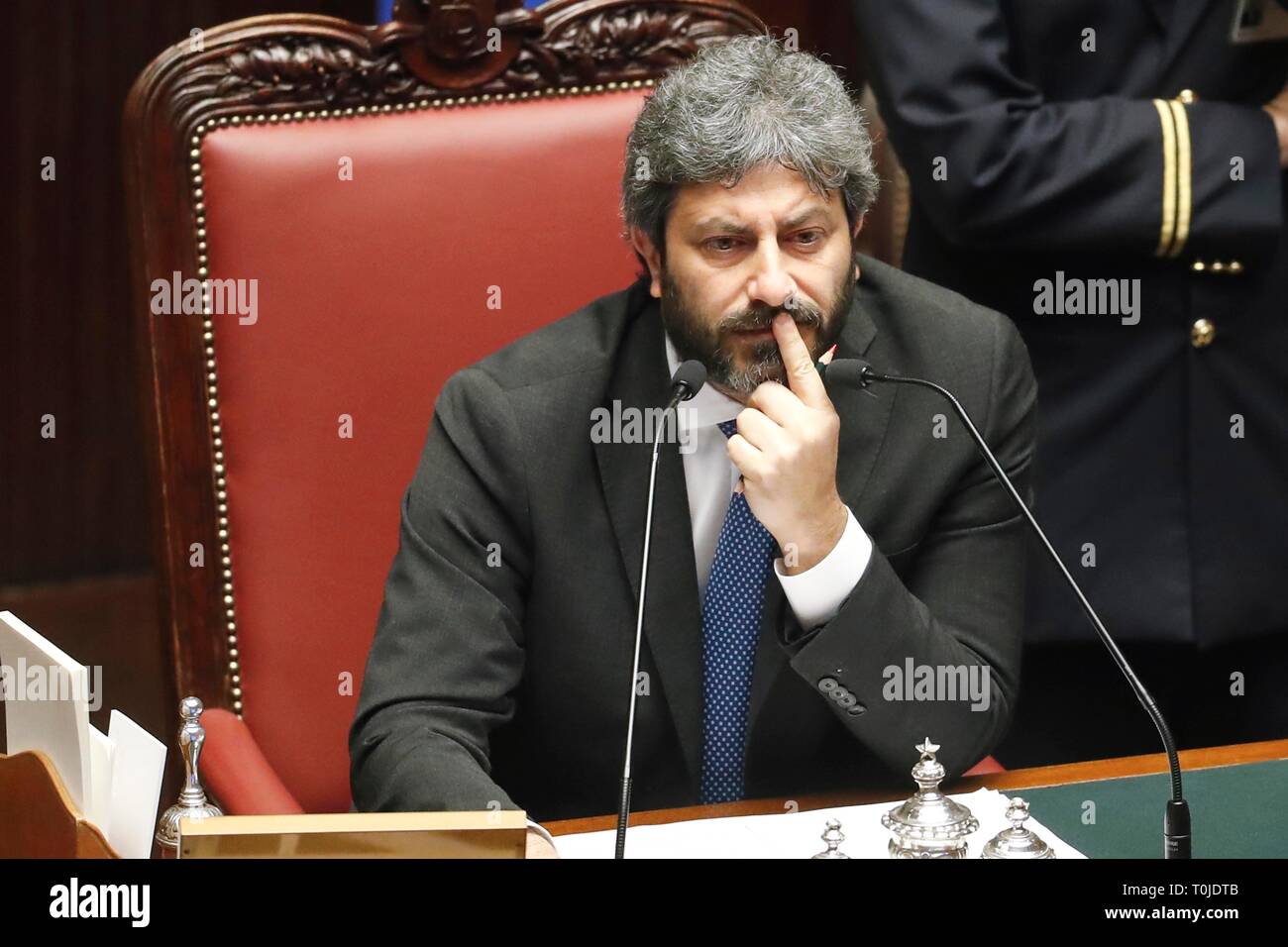 Italy, Rome, March 19, 2019 : Roberto Fico, Speaker of Chamber of Deputies, listens the Prime Minister Giuseppe Conte during his communication on the  Stock Photo