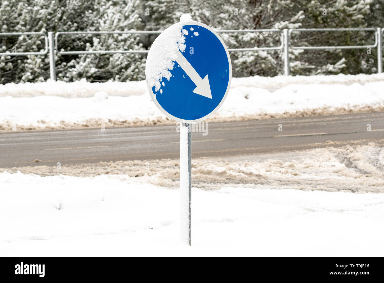 Warning traffic sign. Frozen Road ice-covered direction sign detour on ...