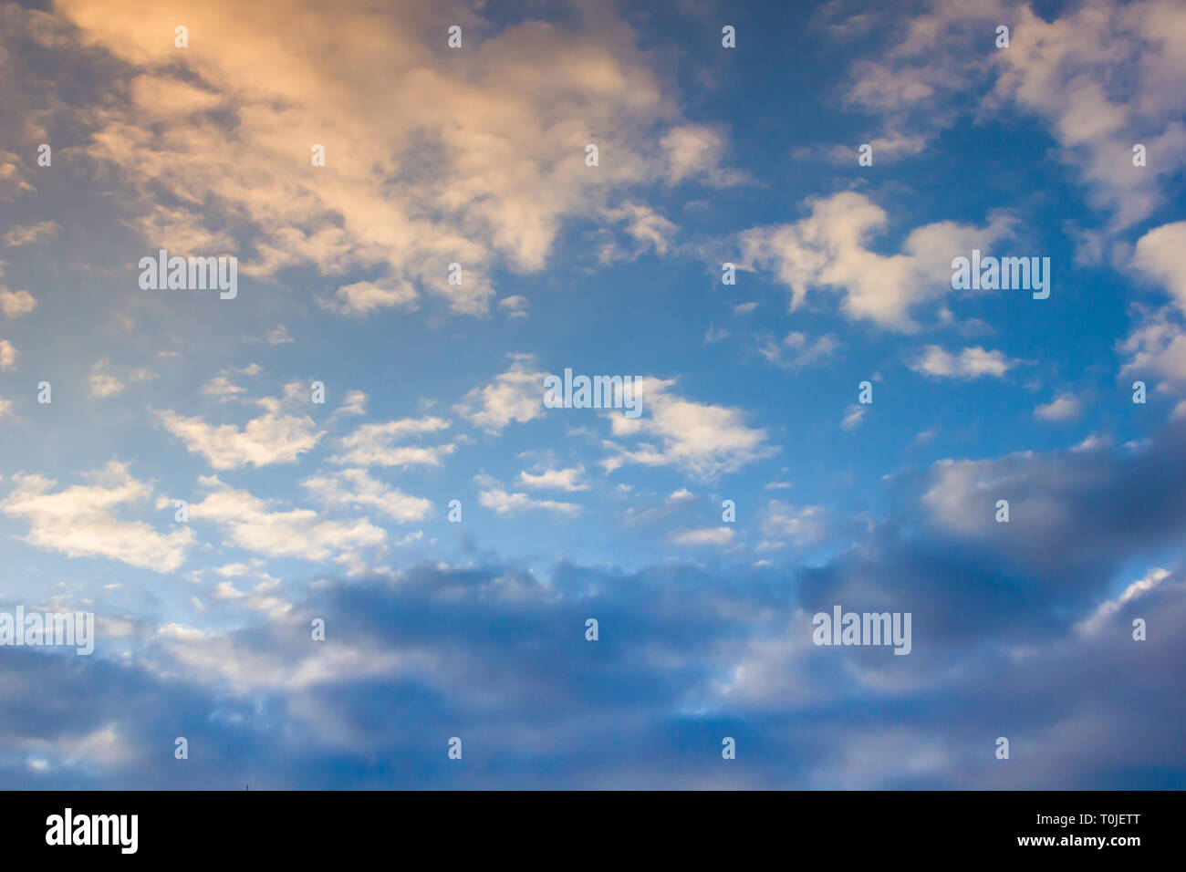 Sunset evening blue sky with clouds. Sky background Stock Photo - Alamy