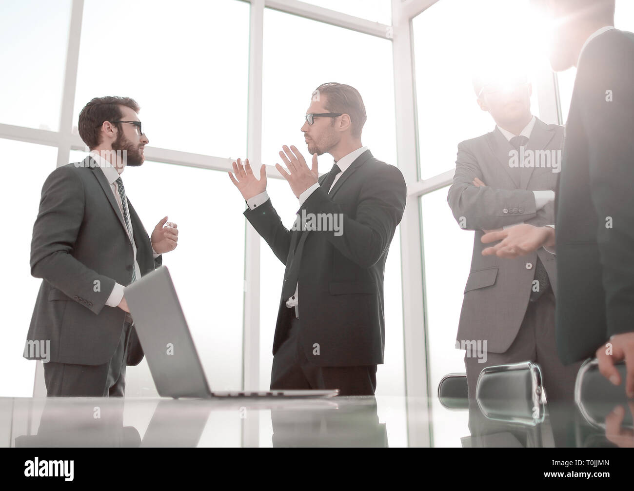business team standing in the office of the business center Stock Photo ...