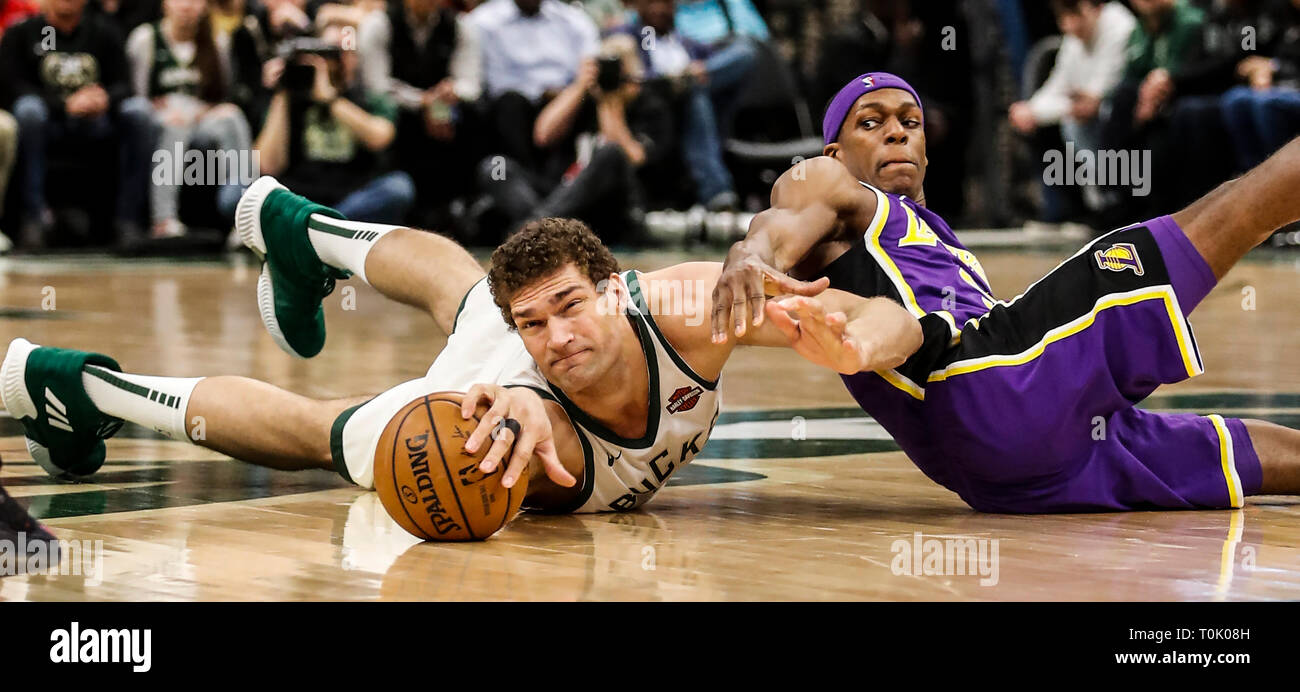 Beijing, USA. 19th Mar, 2019. Milwaukee Bucks' Brook Lopez (L) and Los Angeles Lakers' Rajon Rondo vie for the ball during the NBA regular season basketball game between Los Angeles Lakers and Milwaukee Bucks in Milwaukee, Wisconsin, the United States, on March 19, 2019. Credit: Joel Lerner/Xinhua/Alamy Live News Stock Photo