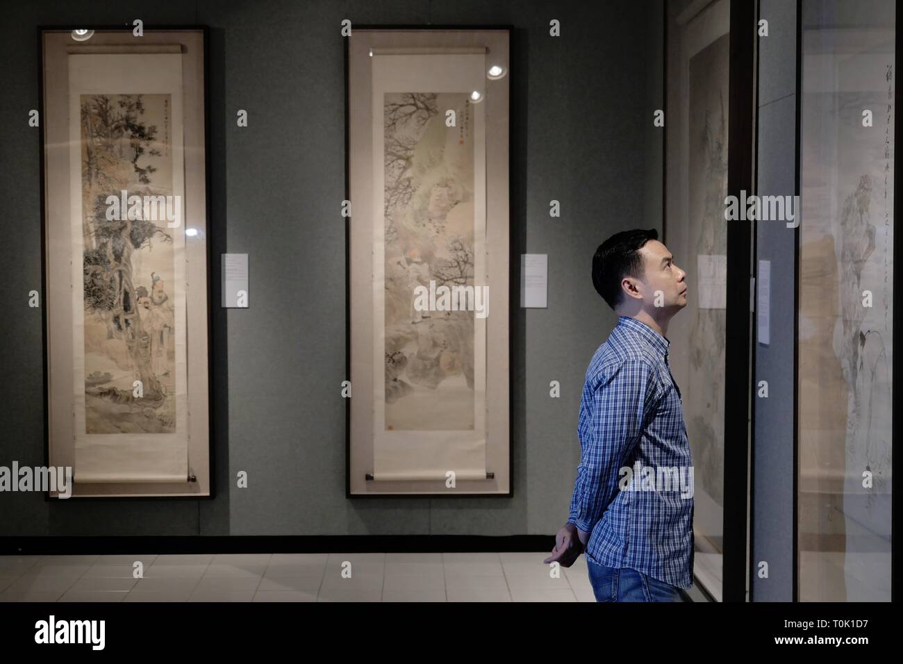 Hong Kong, China. 20th Mar, 2019. A visitor views a painting during an exhibition of Ren Bonian, a famous modern Chinese painter, at Chinese University of Hong Kong, in Hong Kong, south China, March 20, 2019. A total of 82 paintings by Ren Bonian were displayed on the exhibition. Credit: Wang Shen/Xinhua/Alamy Live News Stock Photo