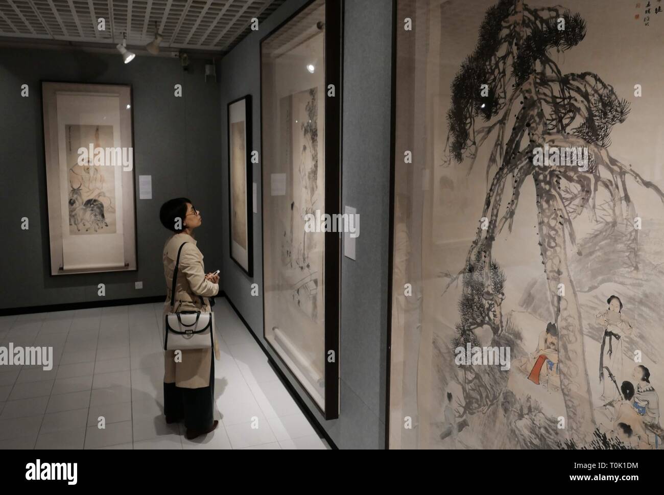 Hong Kong, China. 20th Mar, 2019. A visitor views a painting during an exhibition of Ren Bonian, a famous modern Chinese painter, at Chinese University of Hong Kong, in Hong Kong, south China, March 20, 2019. A total of 82 paintings by Ren Bonian were displayed on the exhibition. Credit: Wang Shen/Xinhua/Alamy Live News Stock Photo