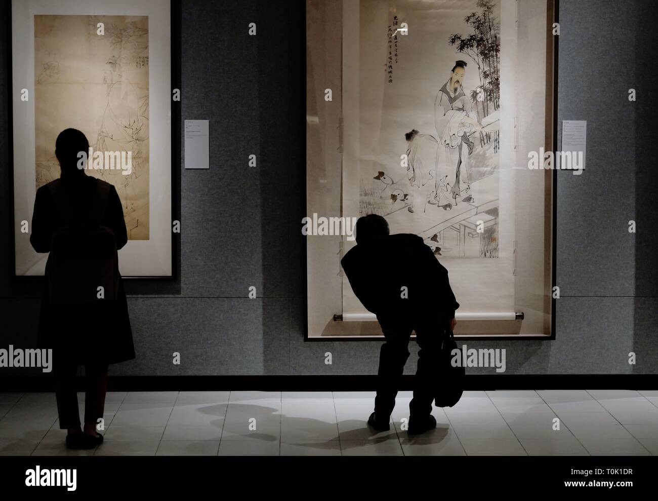 Hong Kong, China. 20th Mar, 2019. Visitors view paintings during an exhibition of Ren Bonian, a famous modern Chinese painter, at Chinese University of Hong Kong, in Hong Kong, south China, March 20, 2019. A total of 82 paintings by Ren Bonian were displayed on the exhibition. Credit: Wang Shen/Xinhua/Alamy Live News Stock Photo
