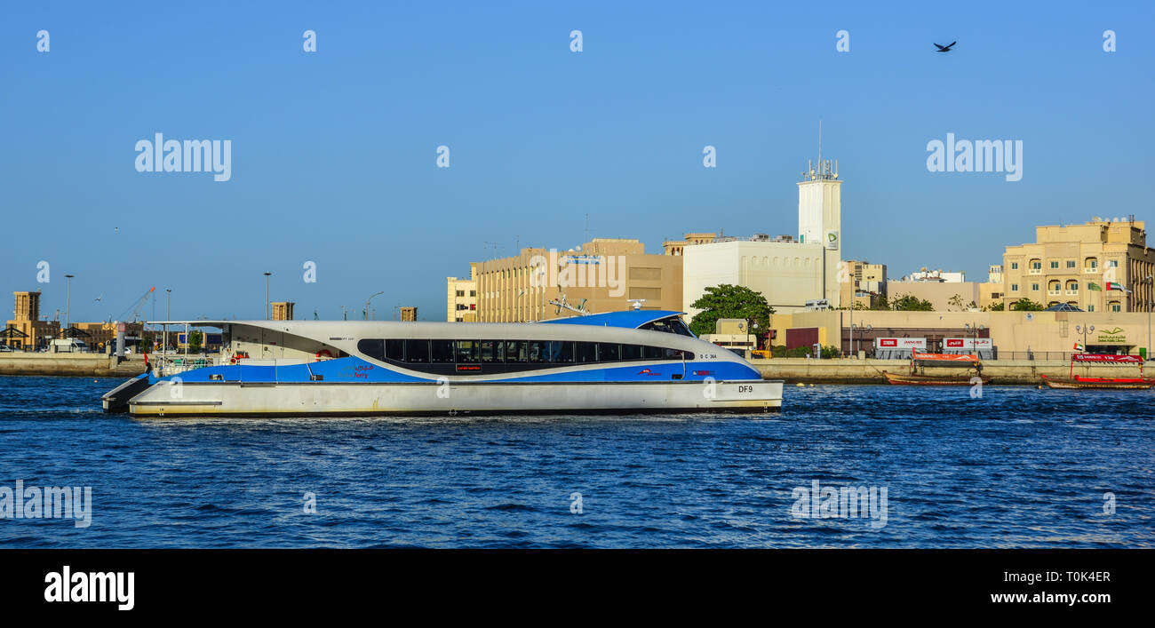 Dubai, UAE - Dec 9, 2018. A speedboat running on Dubai Creek. The creek is a man-made waterway made for the convenience of trade ships. Stock Photo