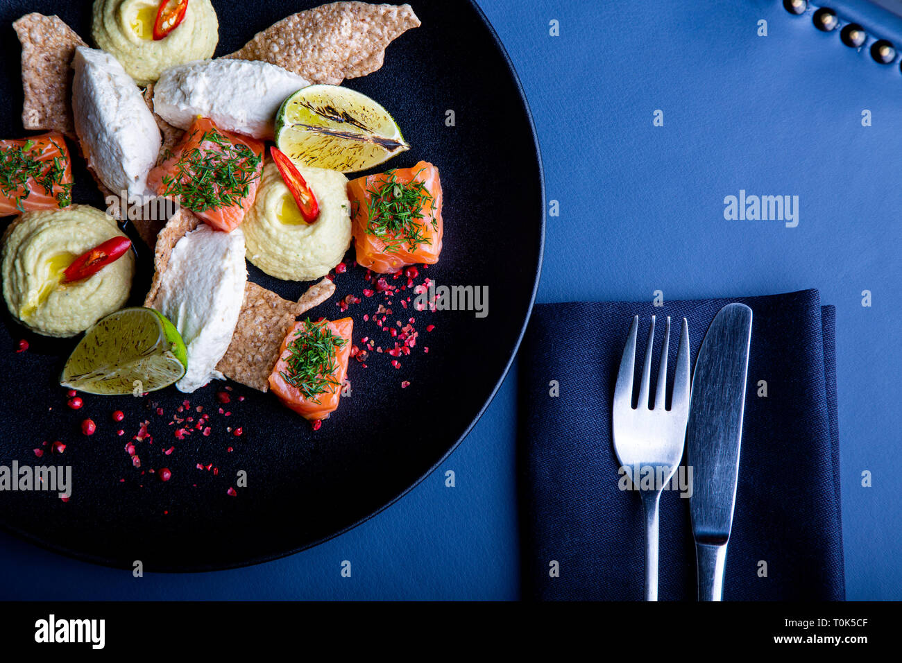delicious with pate and hummus background. Healthy exclusive food on big black platter closeup Stock Photo - Alamy