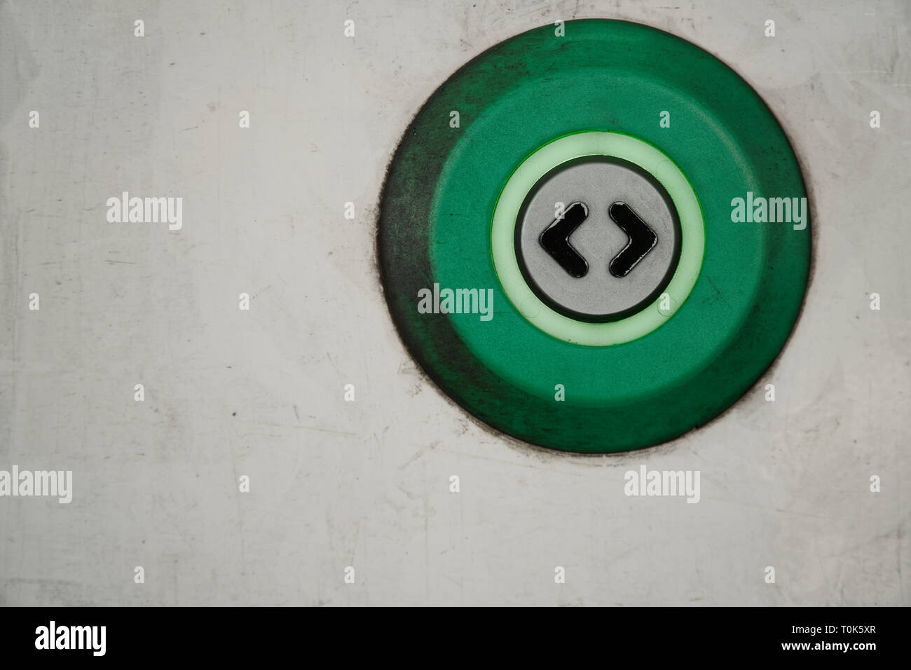 Sliding automatic door in train, open door dirty button with two arrow ...