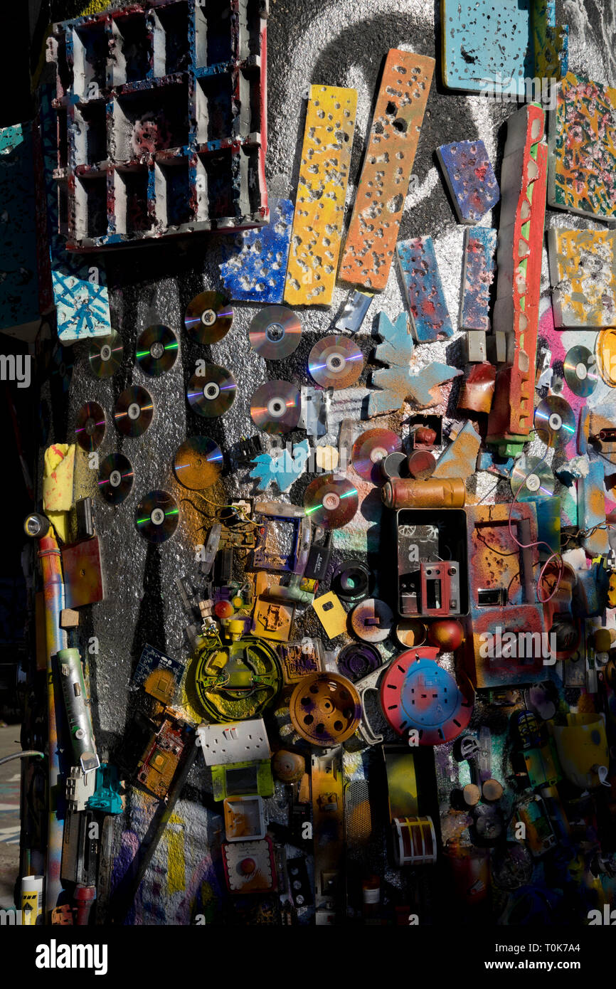 Artist with art installation from recycled materials by Regent's canal