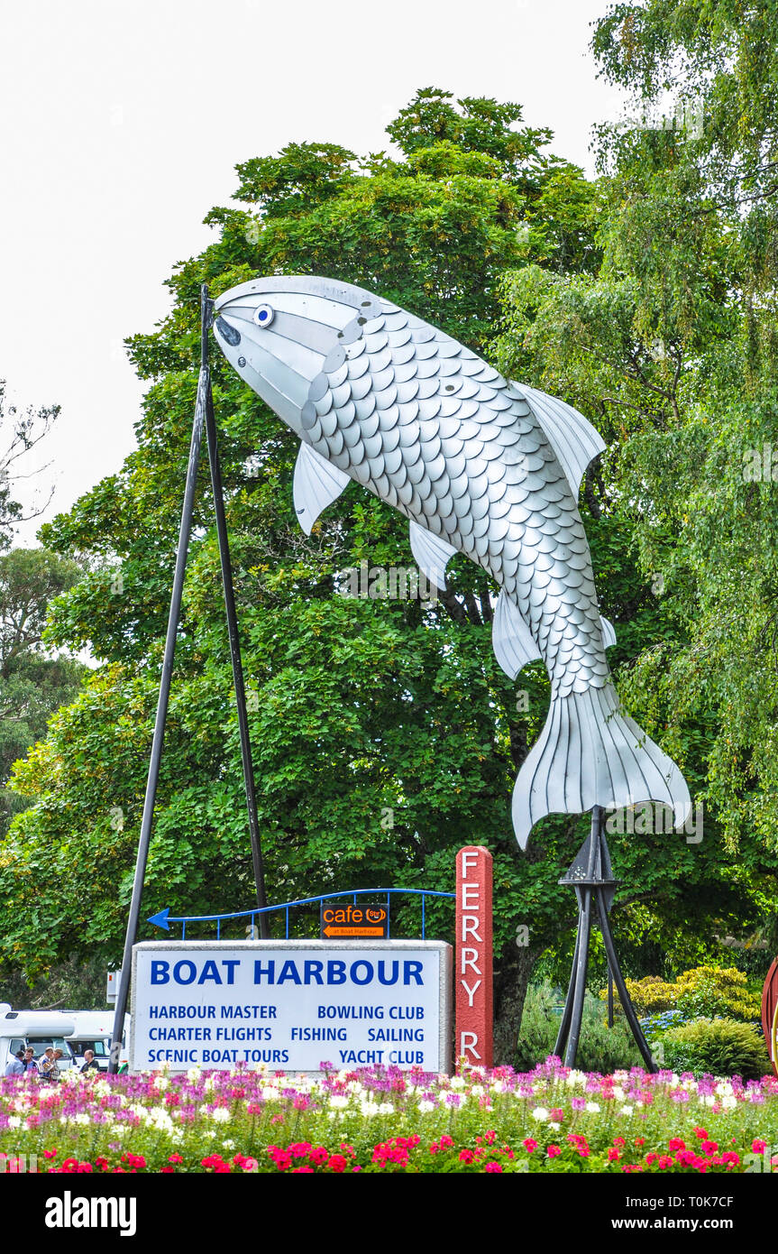 Large fish sculpture. Giant trout feature at Ferry Road Marina, Taupo, Waikato, New Zealand. Sign for businesses and services Stock Photo