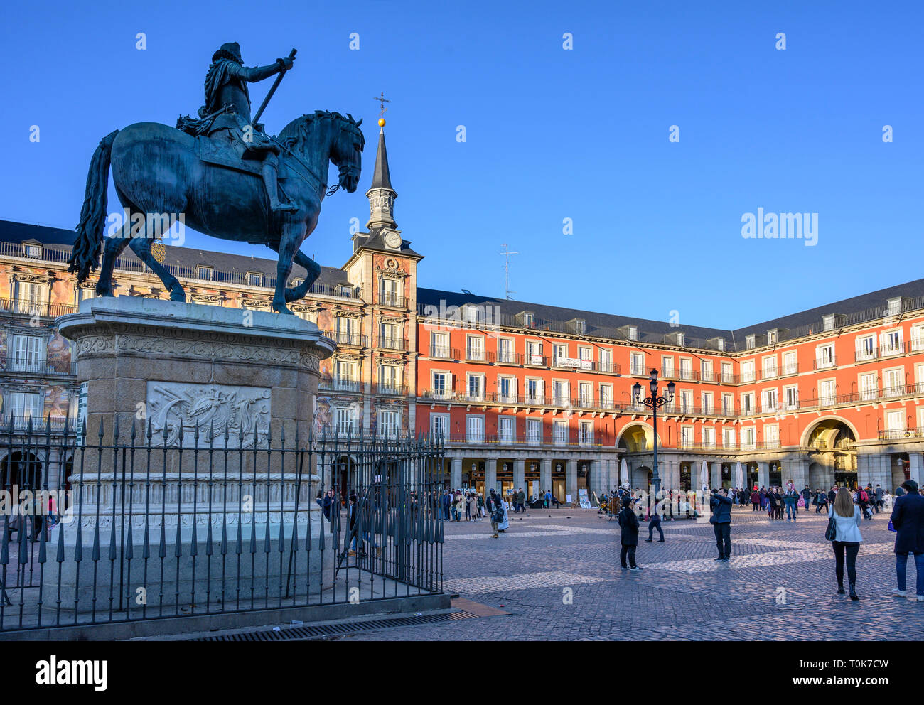 People enjoying the late afternpoon sunshine in the Plaza Mayor in the centre of Madrid. Spain. Stock Photo