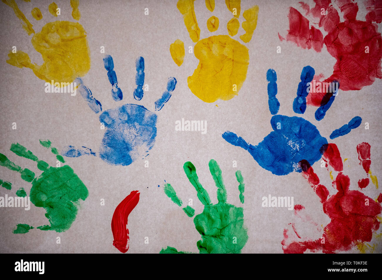Colourful detail children's handprints in paint Stock Photo