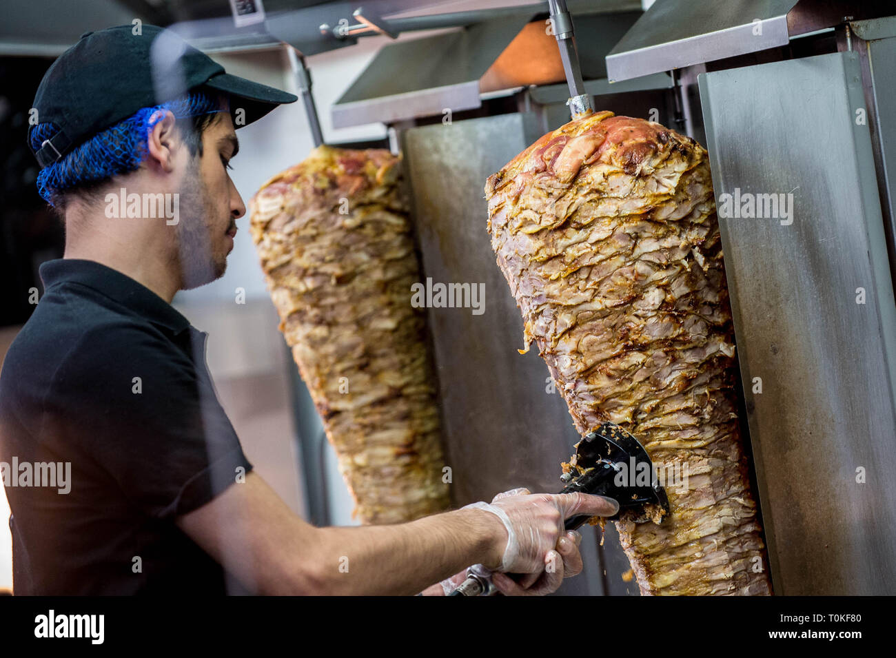 Detail of a Donner kebab meat being  served in a Kebab shop Stock Photo