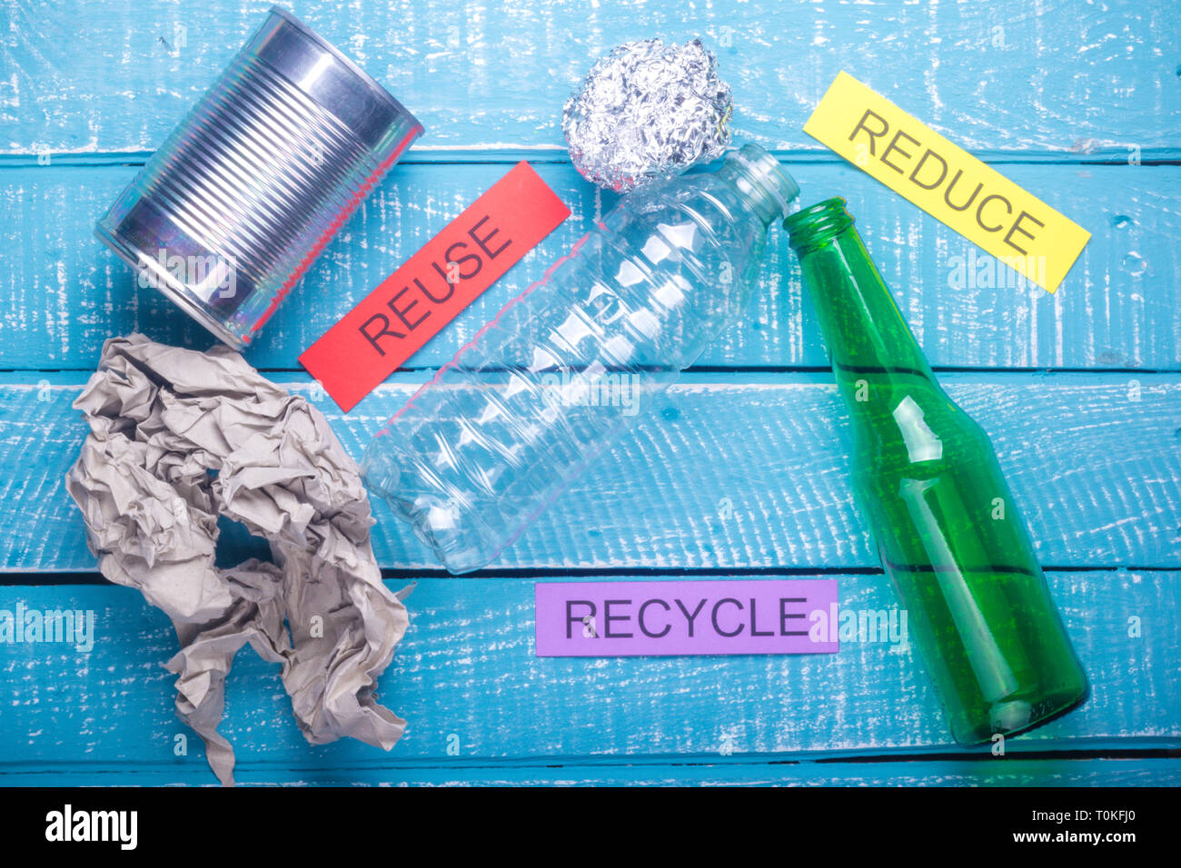 Recycle concept showing waste products of paper, glass, plastic, foil