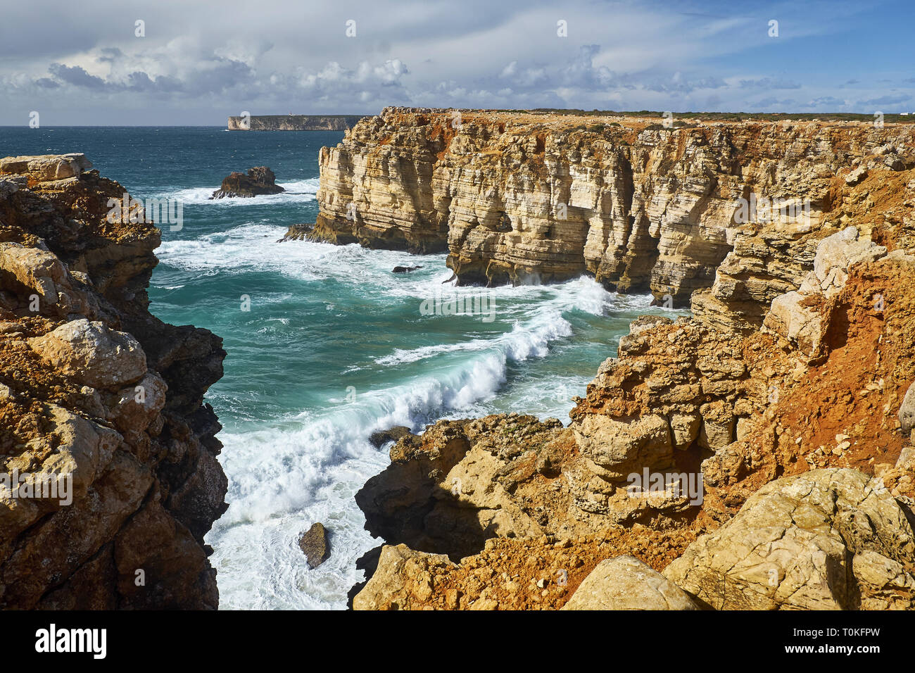 Rocky coast at Cabo de Sao Vicente with stormy sea near Sarges, Algarve, Faro, Portugal Stock Photo