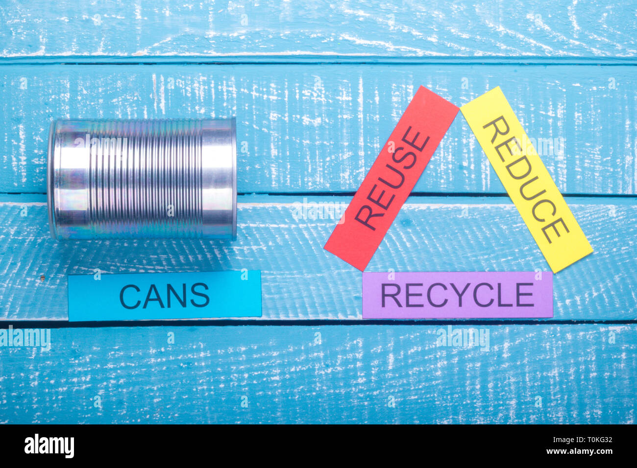 Recycle concept showing reduce, reuse, recycle with cans on a blue ...