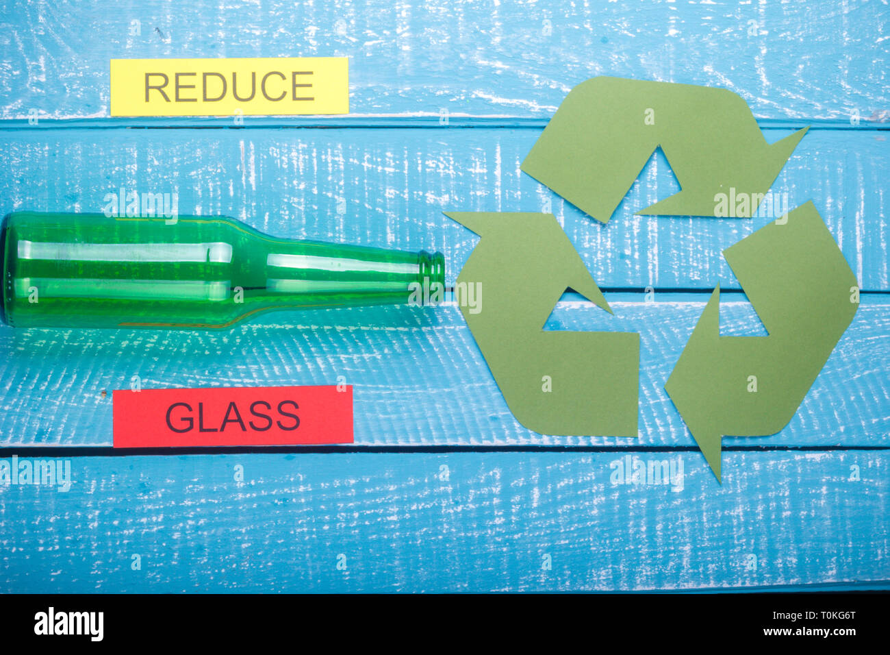 Reduce Glass Example Recycle concept showing glass with the green recycle logo & reduce on a ...
