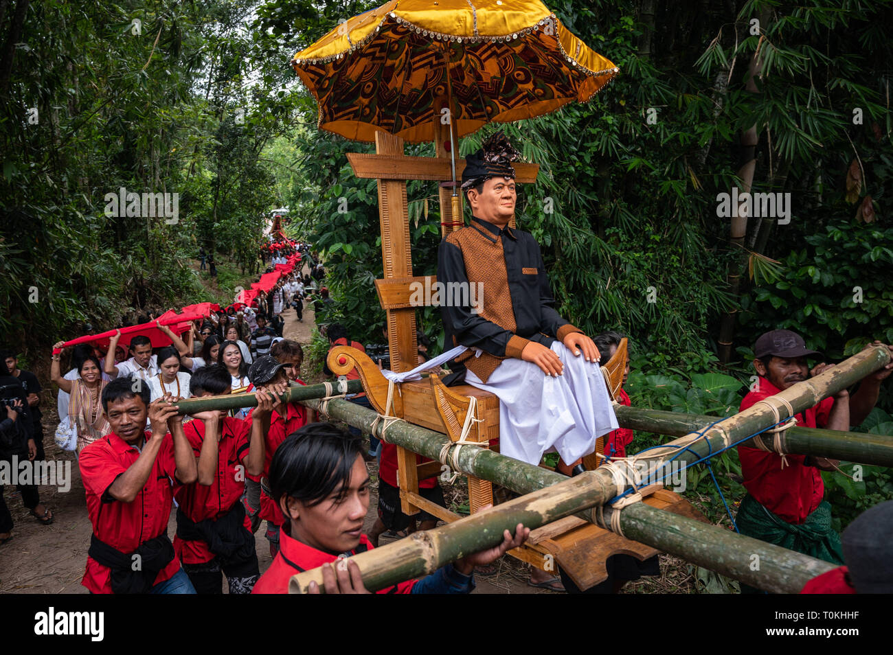 Torajah Communal Ritual Residents are seen carrying Tau-tau (a statue resembling a corpse) and ...