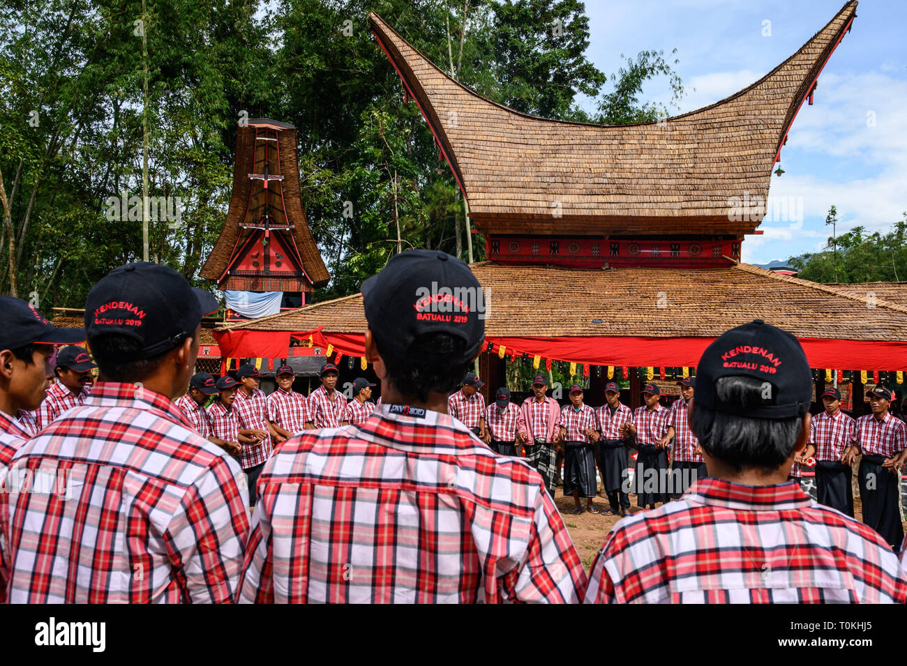 Residents are seen performing the ma'badong dance during the Rambu Solo ritual in Tana Toraja District, South Sulawesi. Rambu Solo is a funeral procession for the Tana Toraja community to honour their ancestors. The procession consists of several event arrangements and lasts for several days. Stock Photo