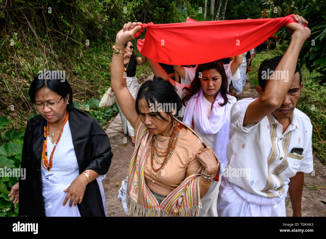 Residents are seen pulling red cloth during the Rambu Solo ritual in Tana Toraja Regency, South Sulawesi. Rambu Solo is a funeral procession for the Tana Toraja community to honour their ancestors. The procession consists of several event arrangements and lasts for several days. Stock Photo
