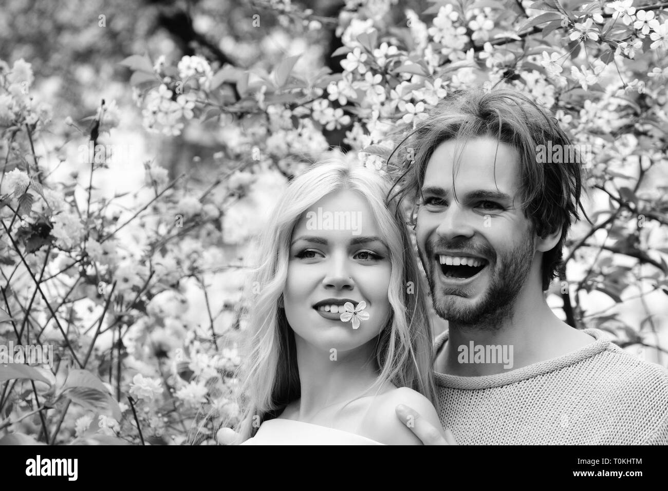 happy couple in love in spring cherry flowers Stock Photo