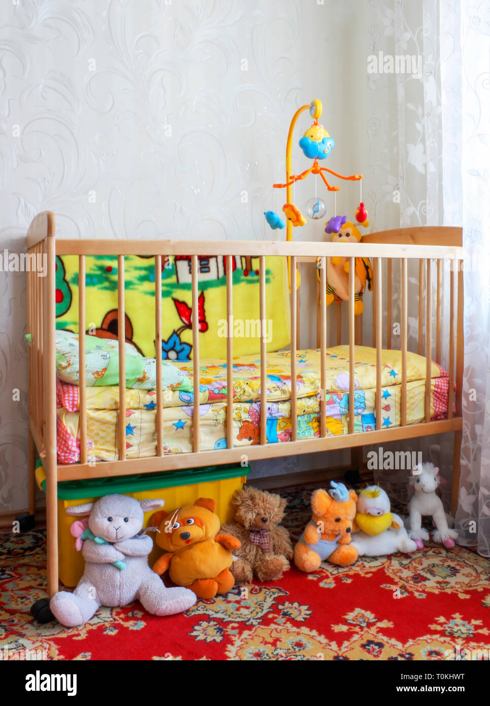 Baby crib in the children's room with toys Stock Photo Alamy
