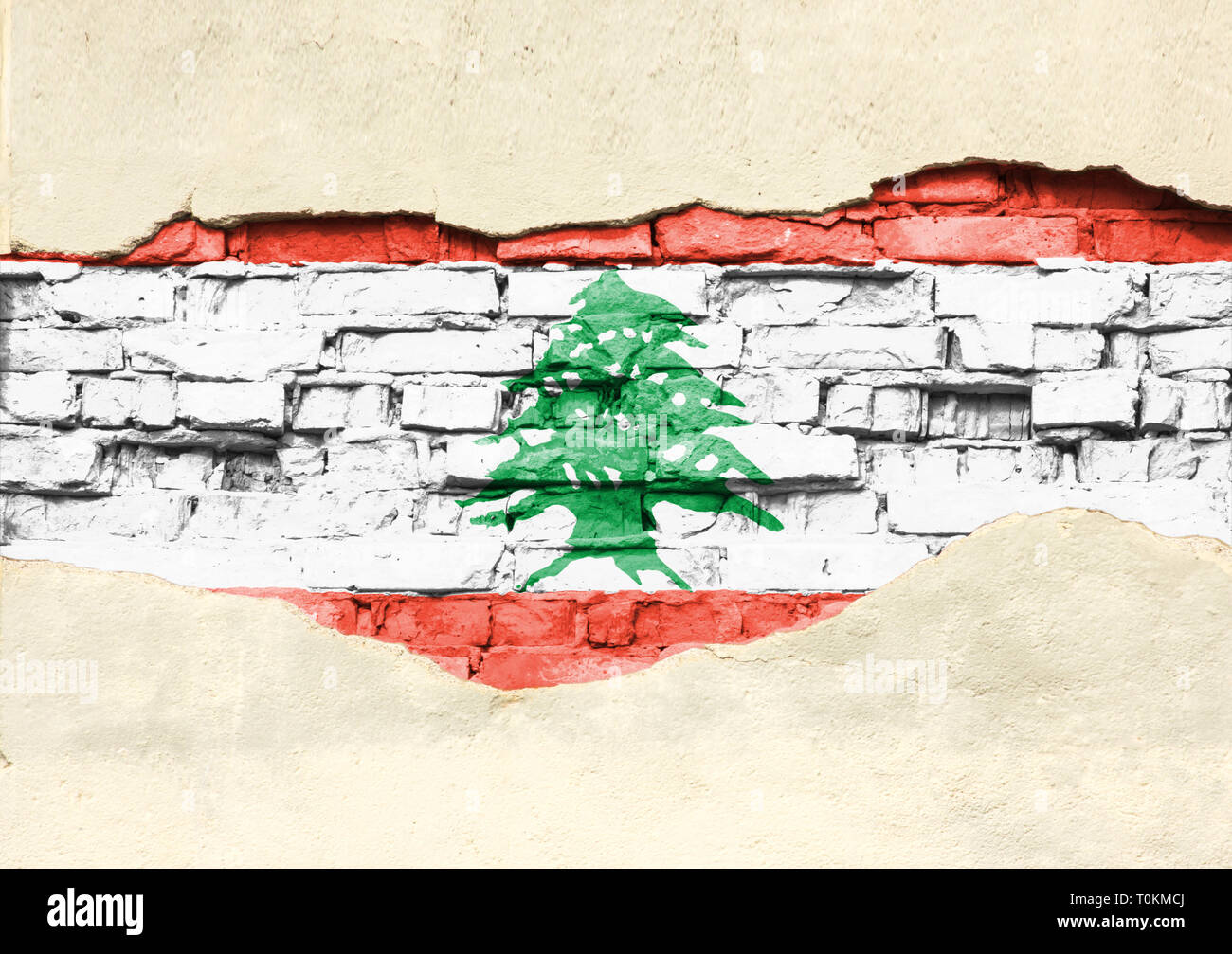 National flag of Lebanon on a brick background. Brick wall with partially destroyed plaster, background or texture. Stock Photo