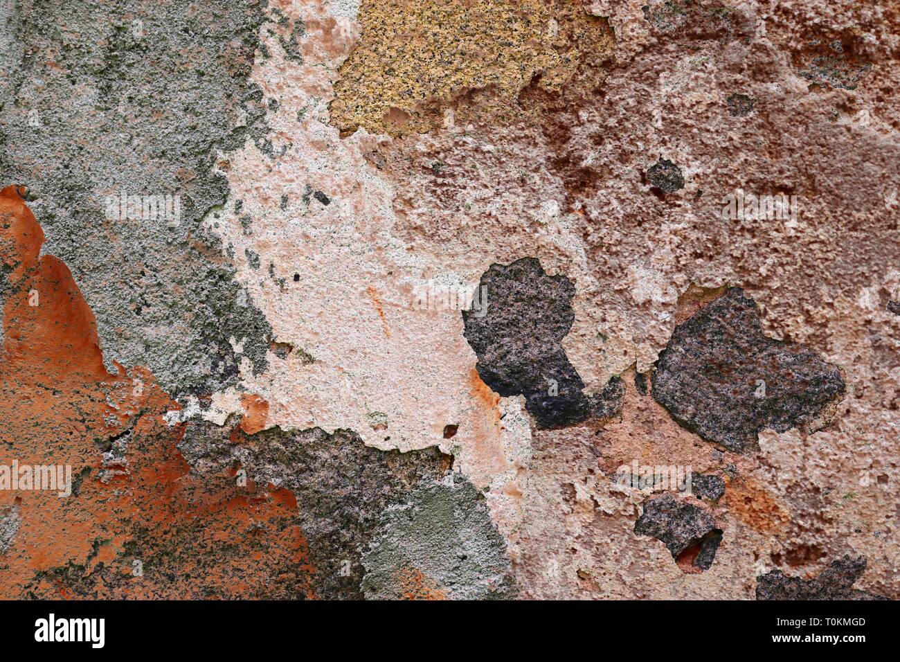 Close up detailed surface of weathered paint on different walls in high
