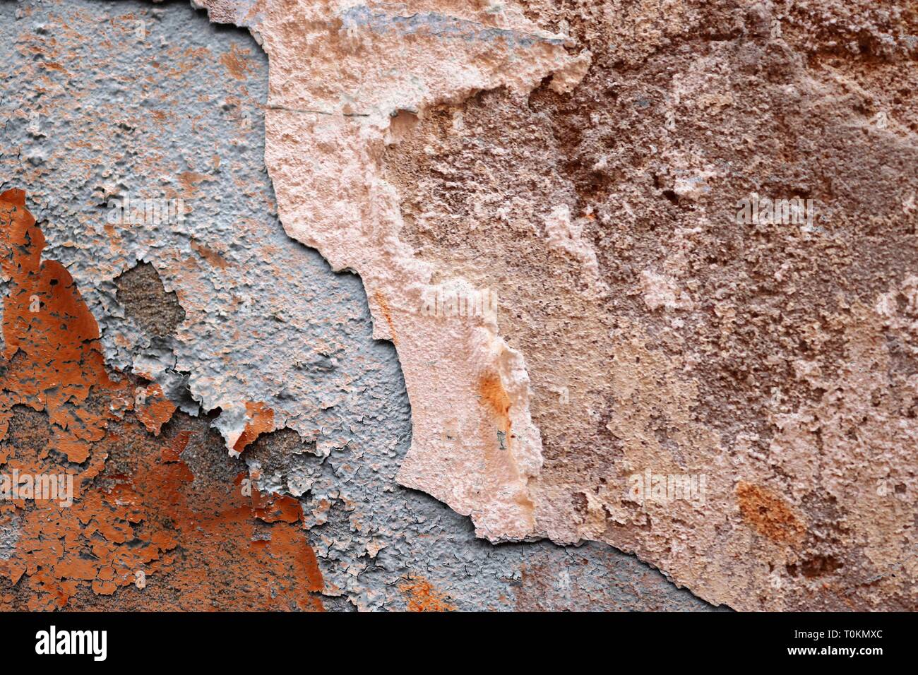 Close up detailed surface of weathered paint on different walls in high