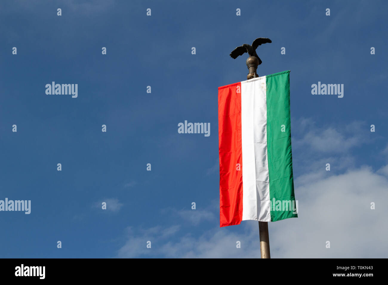 The Flag of Loyalty against blue sky in Sopron, Hungary, low angle view Stock Photo