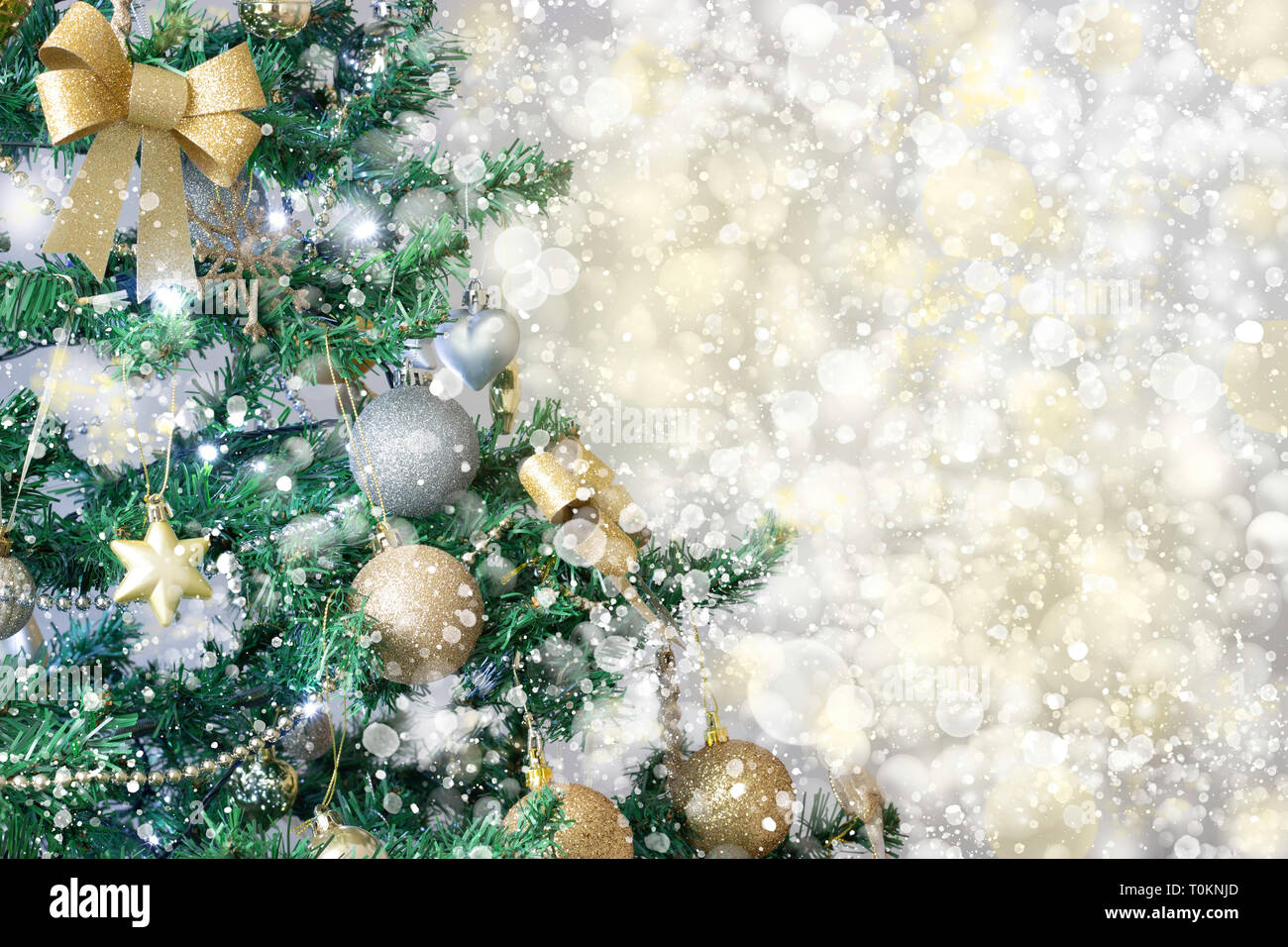 A beautiful Christmas tree festive background with textured snow effect Stock Photo