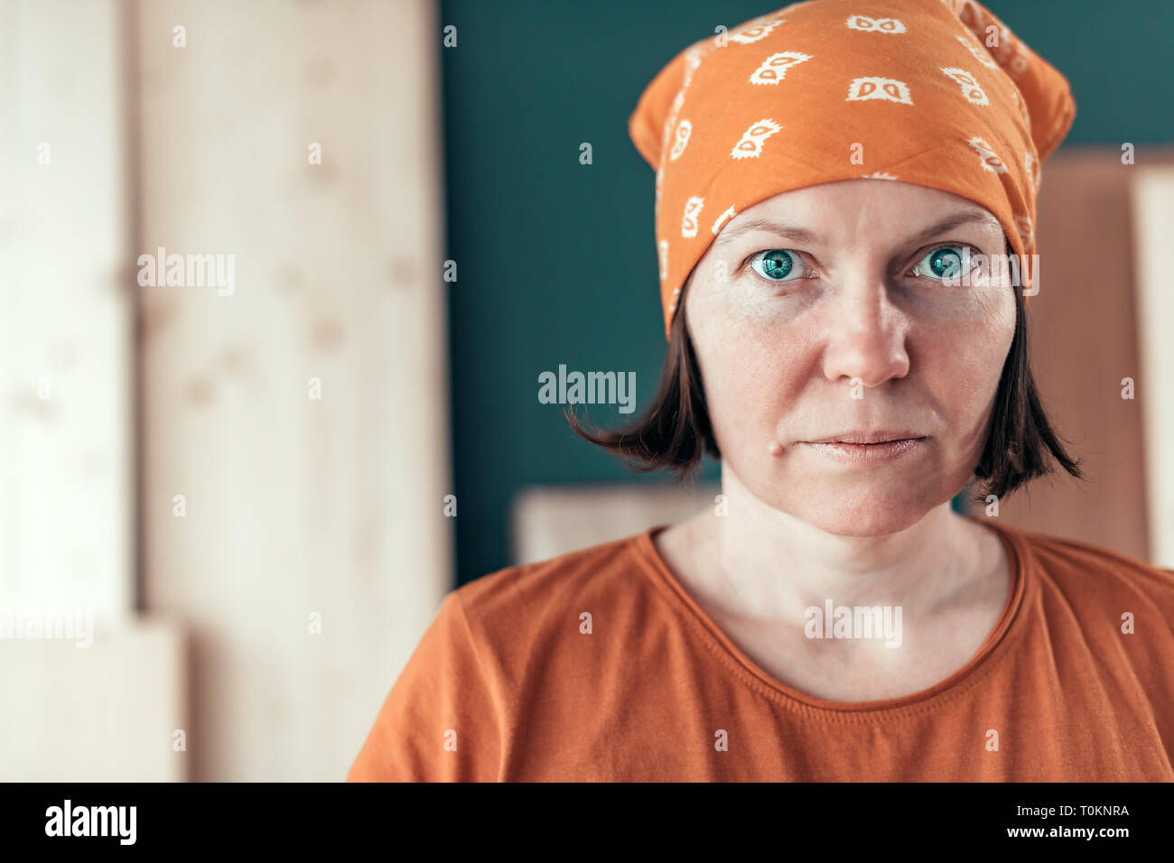 Confident self employed female carpenter portrait in her small business woodwork workshop Stock Photo