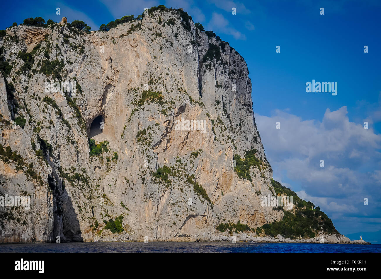 Vertical walls of the rocky coast of the island of Capri, Italy Stock Photo
